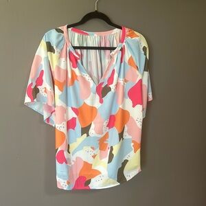 Puchased at local boutique. Size is M but is oversized, fits like a L.